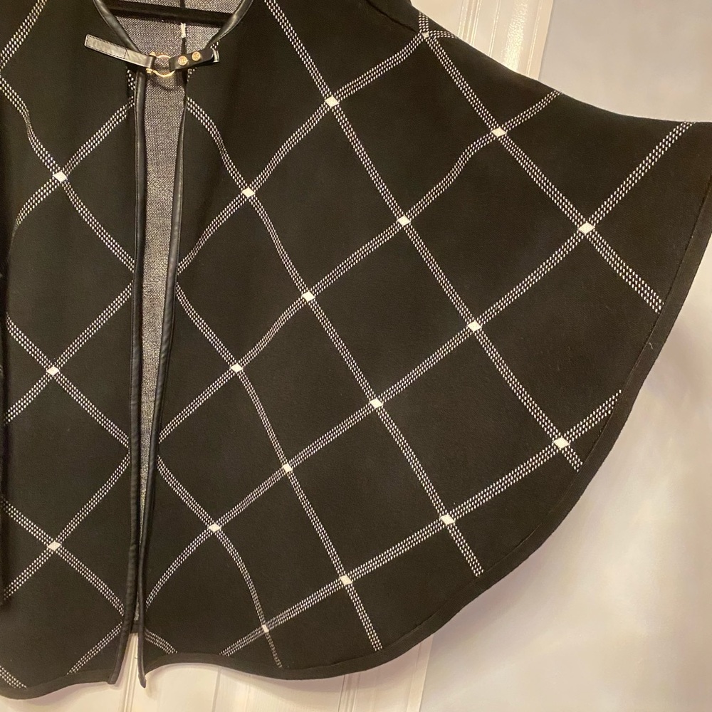 Black cape with white pattern